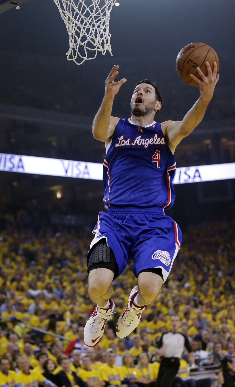 Los Angeles Clippers' J.J. Redick scores on a breakaway layup against the Golden State Warriors during the first half in Game 3 of an opening-round NBA basketball playoff series, Thursday, April 24, 2014, in Oakland, Calif. (AP Photo/Marcio Jose Sanchez)