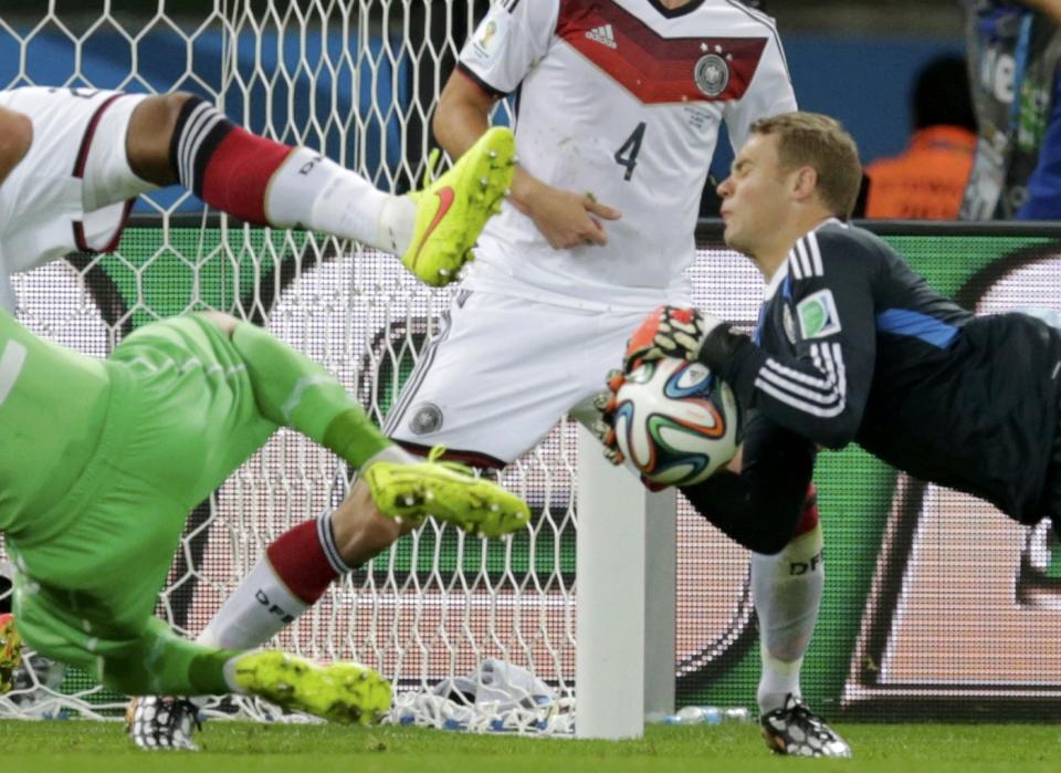 Germany's goalkeeper Manuel Neuer makes a save during their 2014 World Cup round of 16 game against Algeria at the Beira Rio stadium in Porto Alegre June 30, 2014. REUTERS/Henry Romero