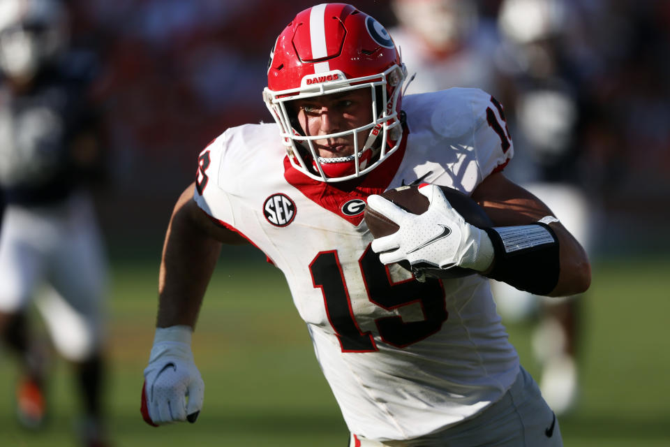 Georgia tight end Brock Bowers carries the ball after a reception during the second half of an NCAA football game against Auburn, Saturday, Sept. 30, 2023, in Auburn, Ala. (AP Photo/ Butch Dill )