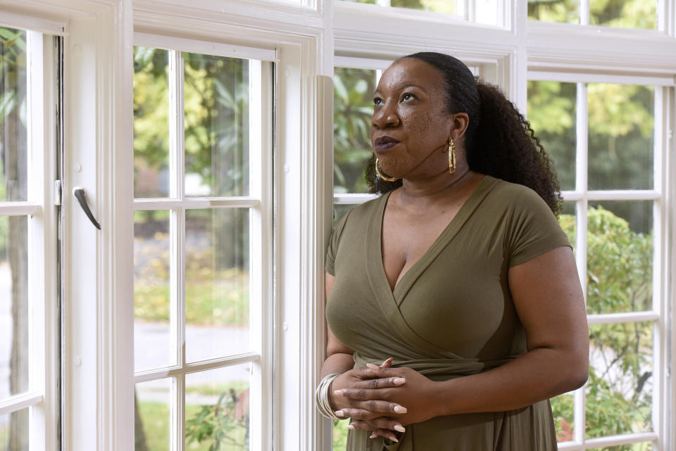 FILE - In this Tuesday, Oct. 13, 2020 file photo, Tarana Burke, founder and leader of the #MeToo movement, stands for a portrait in her home in Baltimore. For Burke, her first reaction to the Wednesday, June 30, 2021, Pennsylvania court decision on Bill Cosby's release was ”shock, definitely shock.” “And as the shock settled in and I started seeing some of the (social media) commentary coming in … we, folks who do this work across the field, started huddling together to talk about what our response would be,” Burke said in an interview. “It was just real concern for survivors. We’re going to have a hard time sleeping.” (AP Photo/Steve Ruark, File)