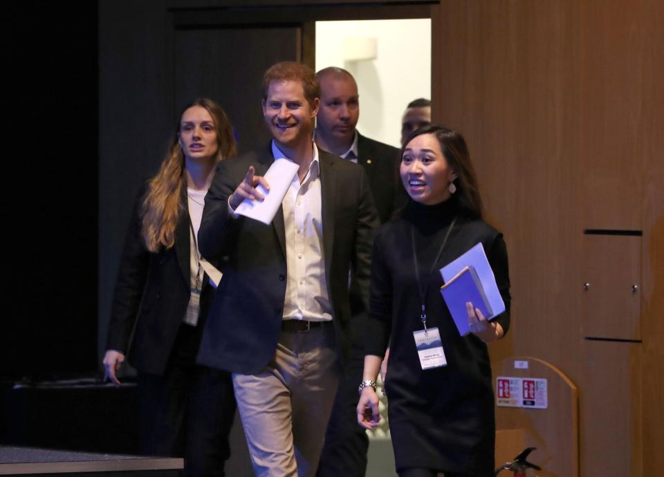 Harry beamed happily as he entered the conference in Edinburgh (PA)