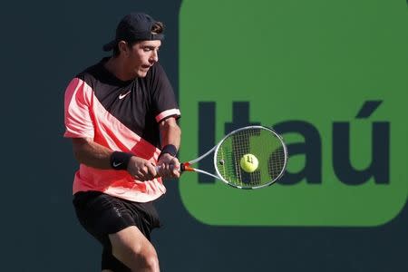 Mar 24, 2018; Key Biscayne, FL, USA; Thanasi Kokkinakis of Australia hits a backhand against Roger Federer of Switzerland (not pictured) on day five of the Miami Open at Tennis Center at Crandon Park. Mandatory Credit: Geoff Burke-USA TODAY Sports