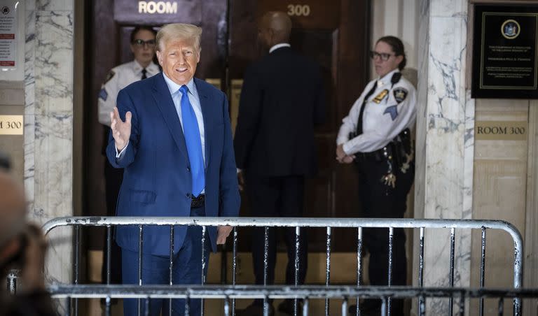 Former President Donald Trump comments with the media during a break in his civil business fraud trial at the New York Supreme Court, Tuesday, Oct. 24, 2023, in New York.(AP Photo/Stefan Jeremiah).