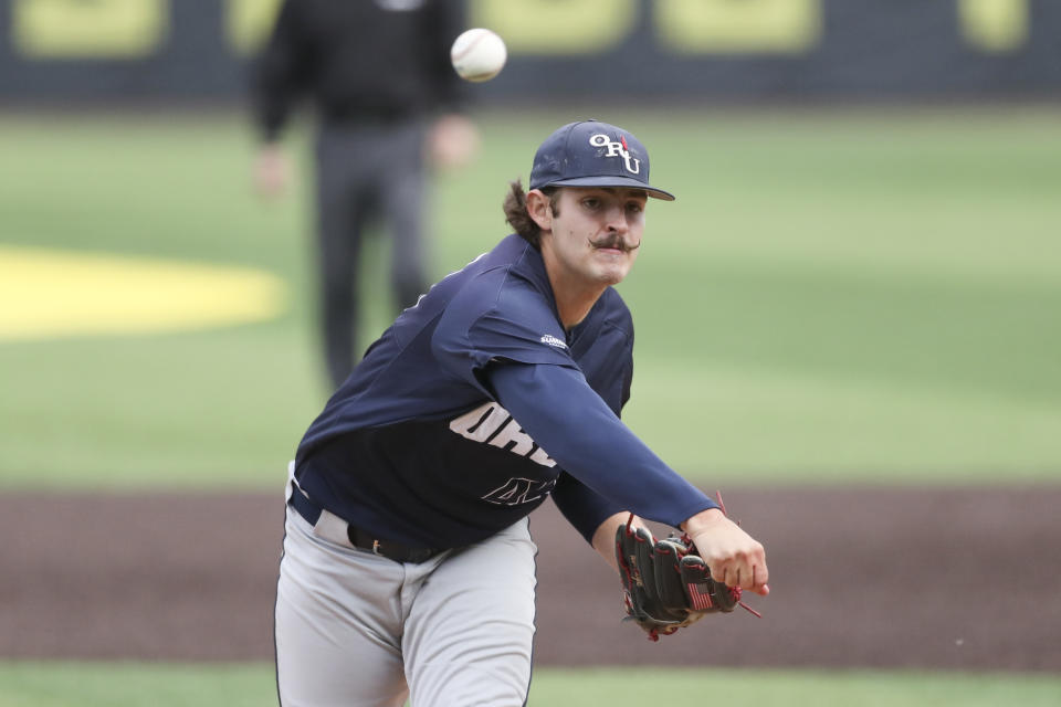 Oral Roberts' Jakob Hall pitches against Oregon during the second inning of an NCAA college baseball tournament super regional game Friday, June 9, 2023, in Eugene, Ore. (AP Photo/Amanda Loman)