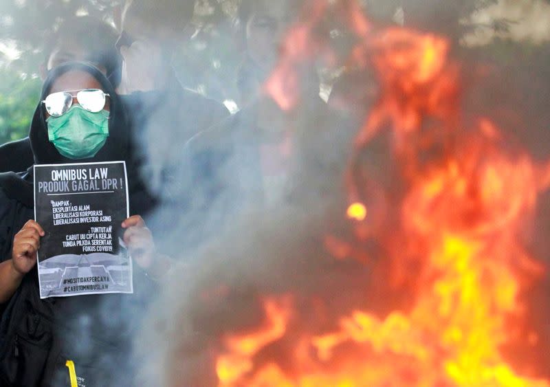 University students protest the government's labour reforms bill in Jakarta