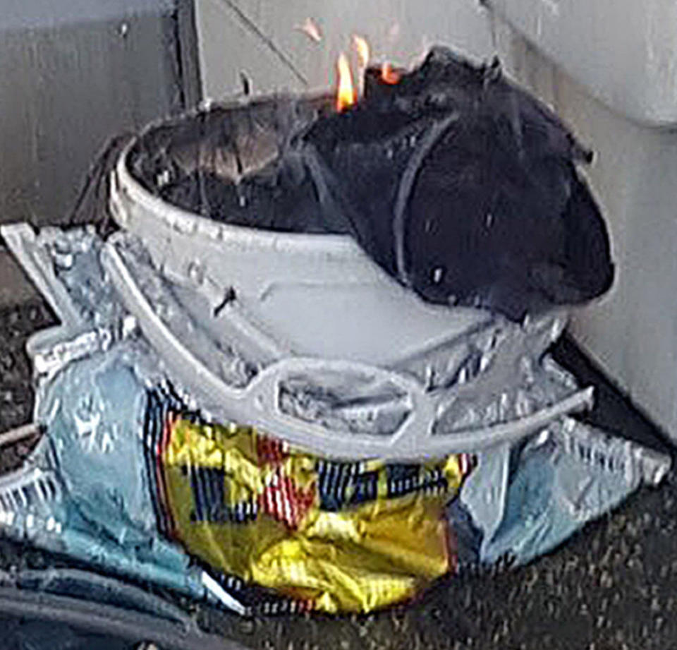 <em>Bucket bomb – eyewitnesses took pictures of a bucket flickering with flames (Picture: Sylvain Pennec/PA Wire)</em>