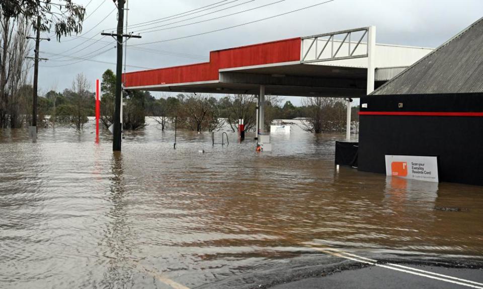 A petrol station inundated by flood waters in Camden in south-west Sydney on Sunday.