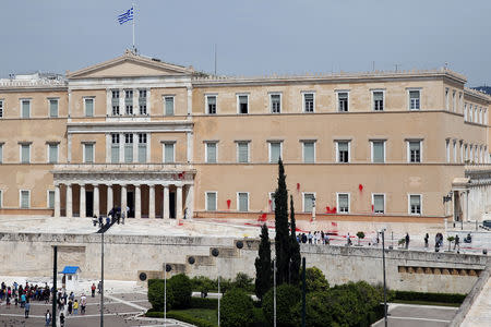 Red paints thrown by unknown attackers are seen at the facade of the Parliament building in Athens, Greece, May 21, 2019. REUTERS/Costas Baltas