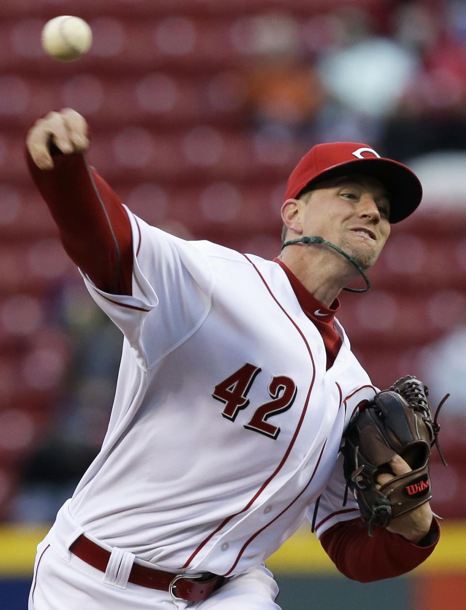 Cincinnati Reds starting pitcher Mike Leake throws to a Pittsburgh Pirates batter in the first inning of a baseball game, Tuesday, April 15, 2014, in Cincinnati. (AP Photo/Al Behrman)