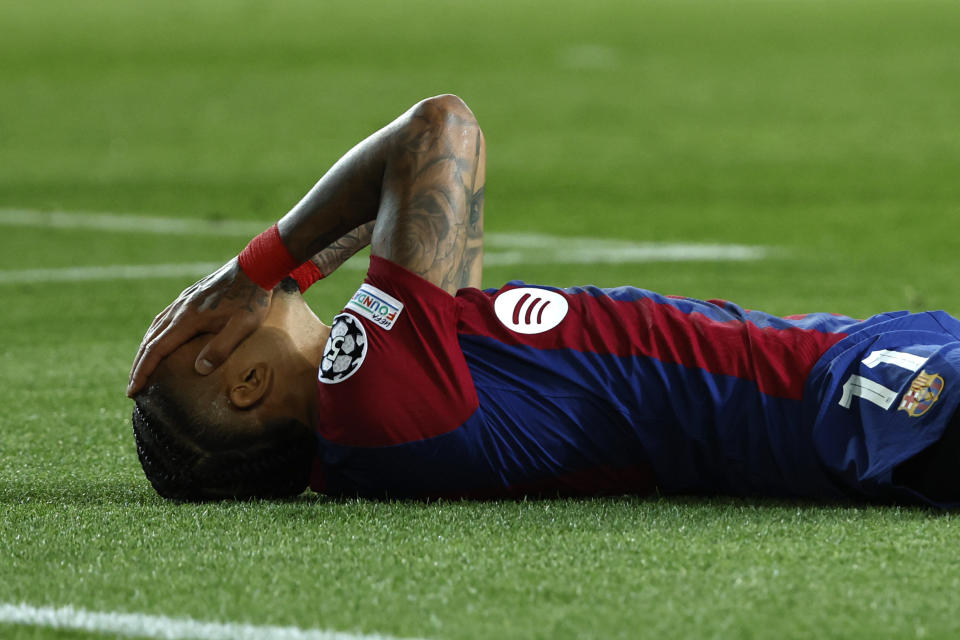 Barcelona's Raphinha reacts after missing a scoring chance during the Champions League quarterfinal second leg soccer match between Barcelona and Paris Saint-Germain at the Olimpic Lluis Companys stadium in Barcelona, Spain, Tuesday, April 16, 2024. (AP Photo/Joan Monfort)