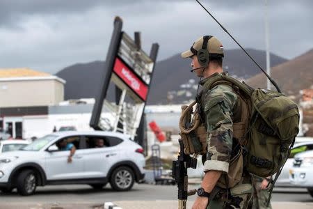 A dutch soldier patrols the streets of Sint Maarten Dutch part of Saint Martin island in the Carribean after the Hurricane Irma September 7, 2017. Picture taken September 7, 2017. Netherlands Ministry of Defence-Gerben van Es/Handout via REUTERS