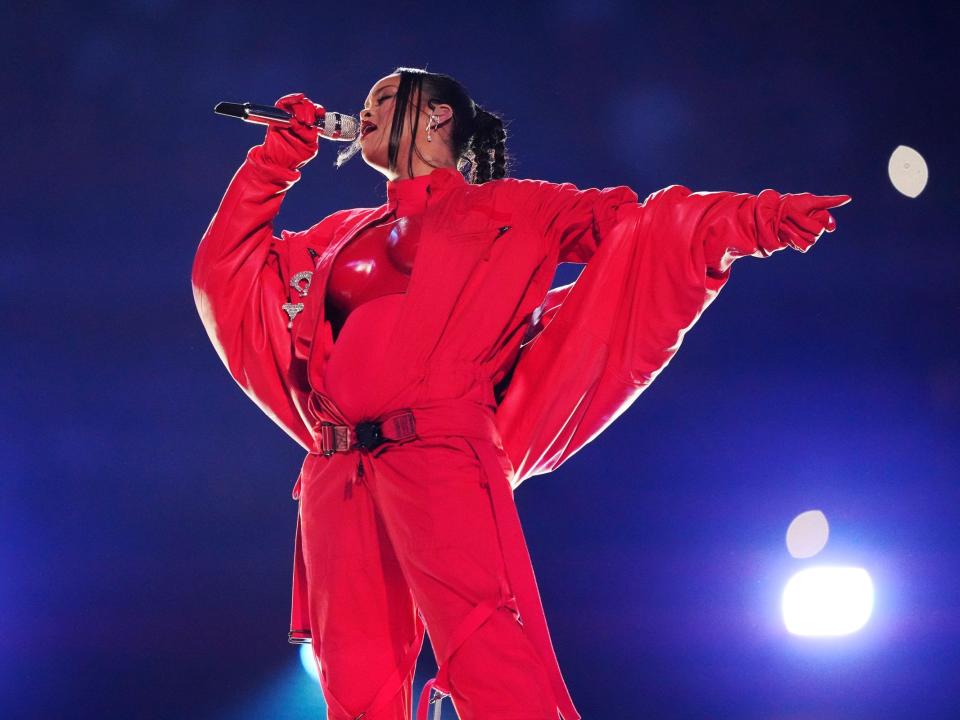 Rihanna sings at the Super Bowl halftime show.