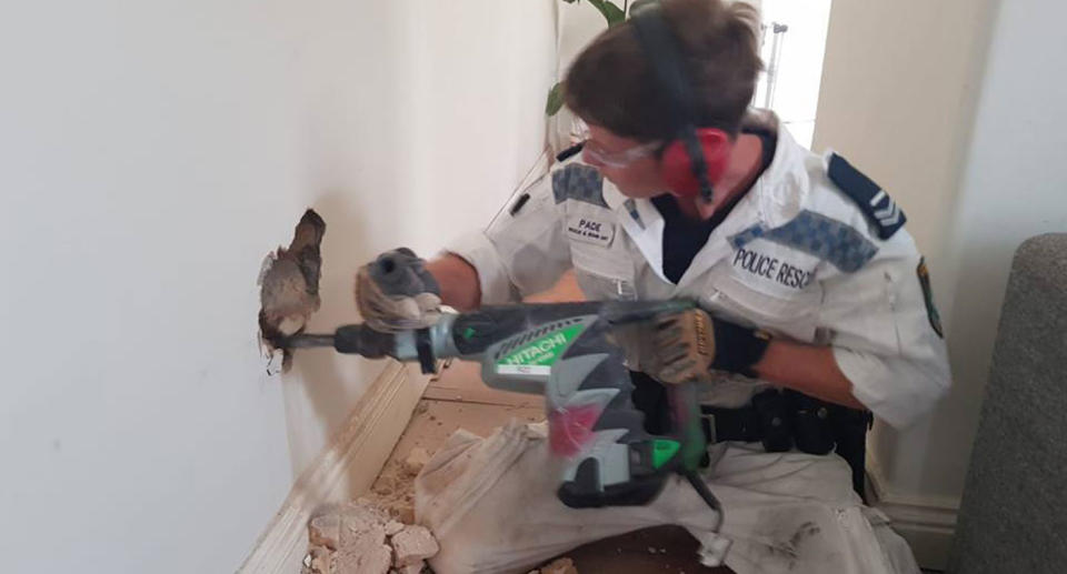 Police had no choice but to try and drill their way to the puppy. Source: NSW Police