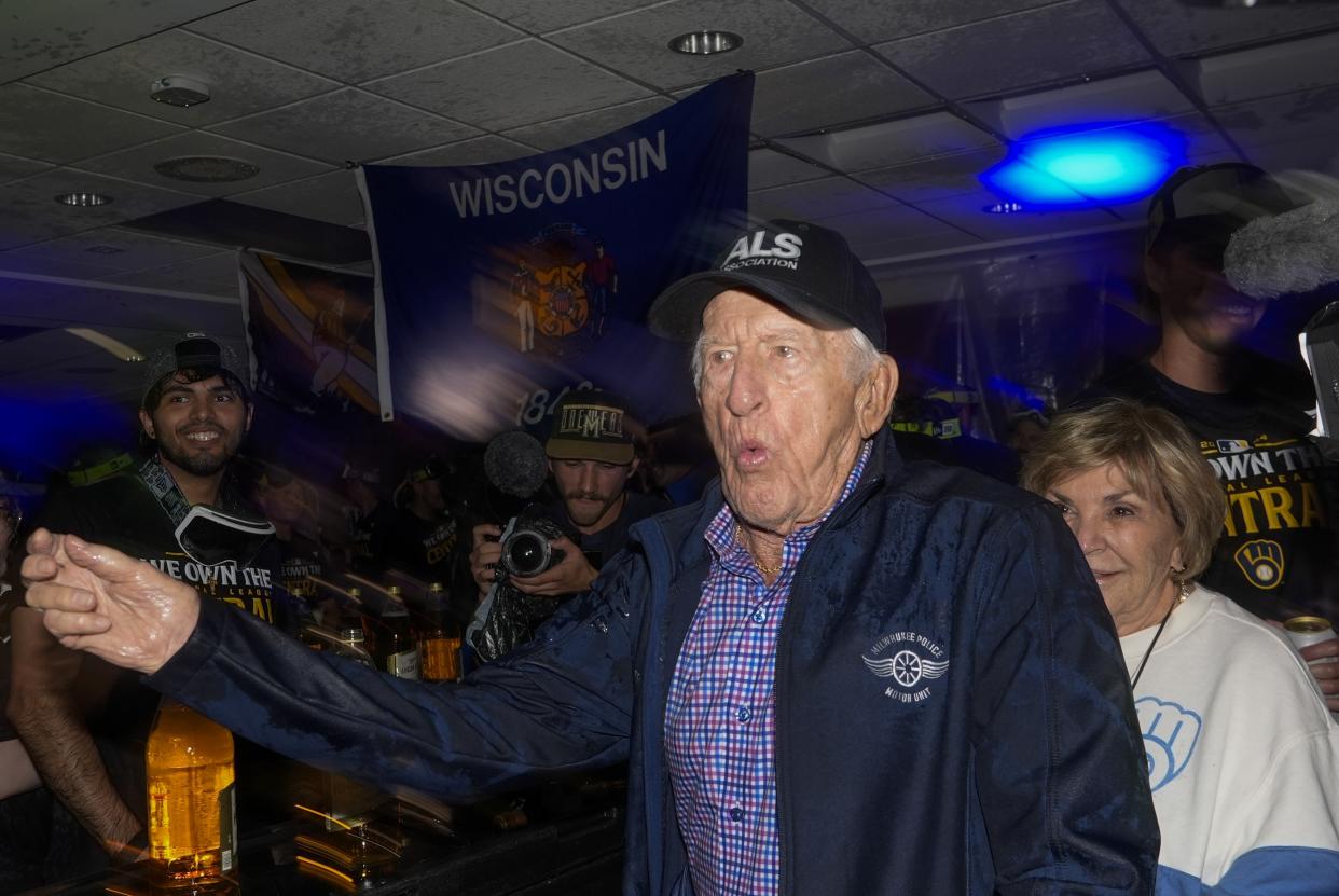 The Milwaukee Brewers annopuncer Bob Uecker celebrates after a baseball game against the Philadelphia Phillies Wednesday, Sept. 18, 2024, in Milwaukee. The Brewers won 2-1 and clinched the National League Central division. (AP Photo/Morry Gash)