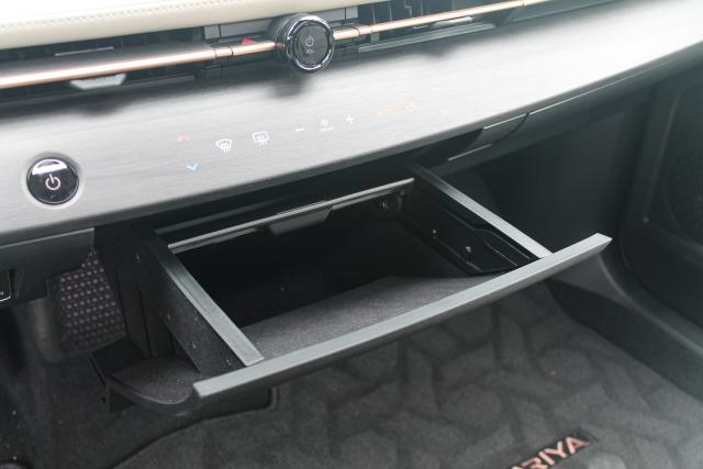 The storage drawer under the dashboard in the 2023 Nissan Ariya.