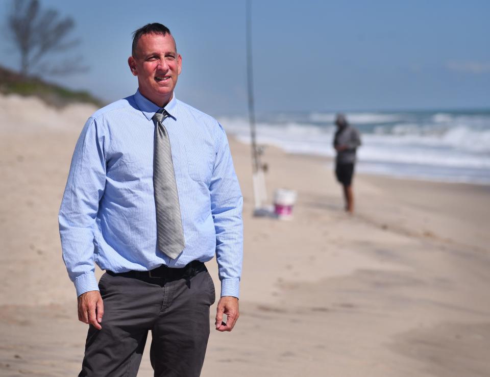 Dr. Robert Abarbanell, who's running for the District 3 Brevard County Commission seat, stands on the beach at the Indian River Oaks beach access. He's running because of the ongoing conflict between homeowners and anglers who fish for sharks in front of his and his neighbors' beachfront properties near the beach access.