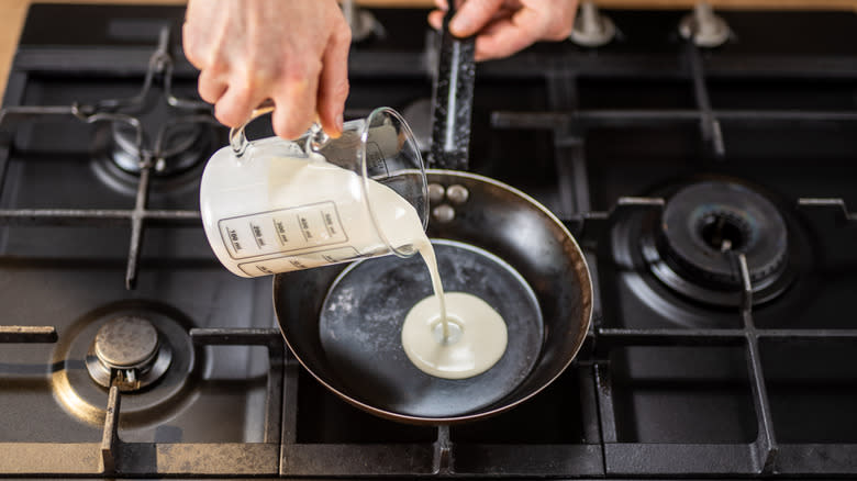 Pouring cream into pan