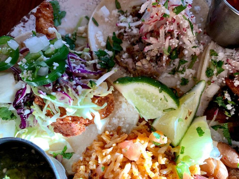 Protein choices at Brewers Row in Tacoma’s North End include pescado, chorizo and al pastor, on tacos with crunchy julienned radishes.