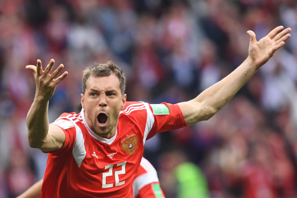 <p>Artem Dzyuba of Russia celebrates after scoring his sides third goal during the 2018 FIFA World Cup Russia group A match between Russia and Saudi Arabia at Luzhniki Stadium on June 14, 2018 in Moscow, Russia. (Getty Images) </p>