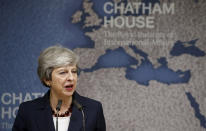 Britain's Prime Minister Theresa May speaks at Chatham House in London, Wednesday July 17, 2019. Prime Minister Theresa May says she worries about the increasing "absolutism" of world politics, in a message many will see as aimed at her successor as Britain's leader and President Donald Trump. (Henry Nicholls/Pool via AP)