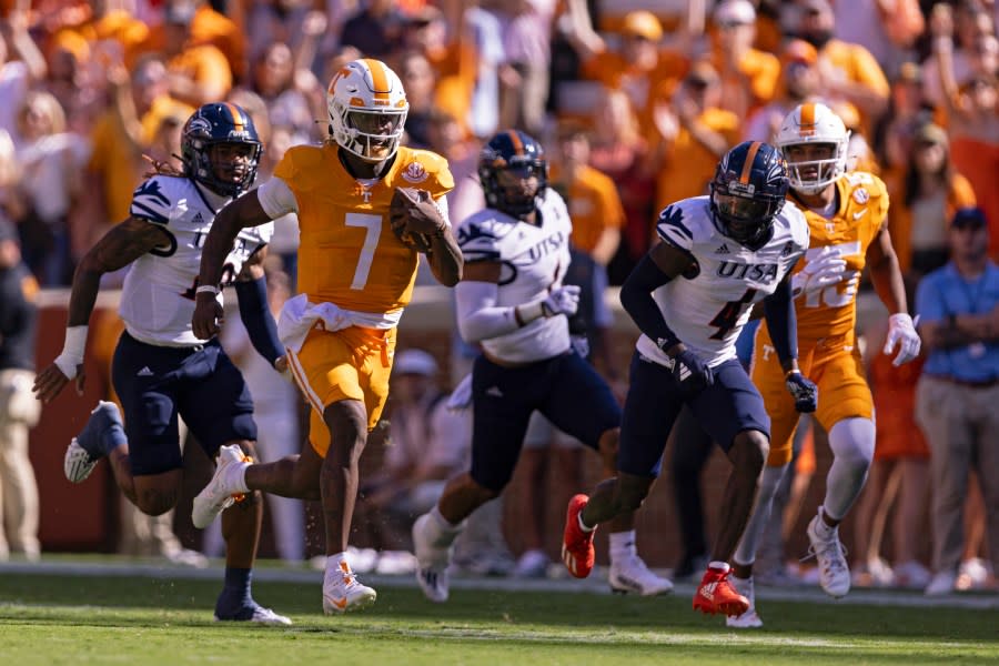 Tennessee quarterback Joe Milton III (7) outruns the UTSA defense for an 81-yard touchdown on the first play of an NCAA college football game Saturday, Sept. 23, 2023, in Knoxville, Tenn. (AP Photo/Wade Payne)