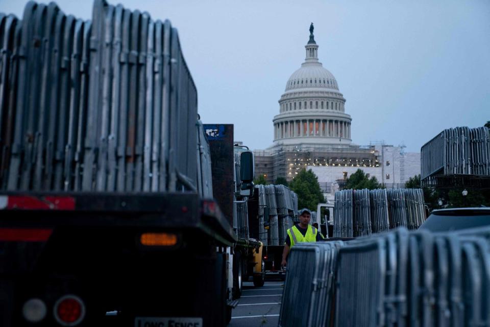 Workers set up security barricades outside the US Capitol in Washington, DC (AFP/Getty)