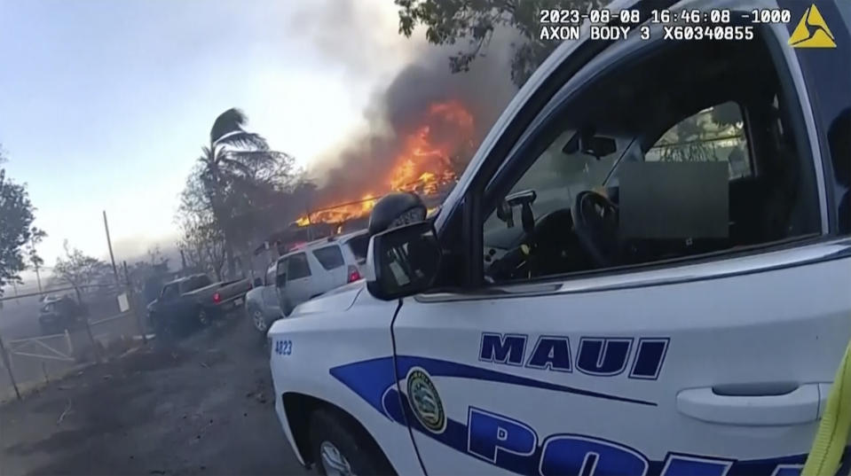 This image provided by Maui Police Department shows police body camera footage taken the day a wildfire tore through Lahaina town on Aug. 8, 2023. Maui police held a news conference on Monday, Oct. 30, 2023 to show 16 minutes of body camera footage taken the day a wildfire tore through Lahaina town. (Maui Police Department via AP)