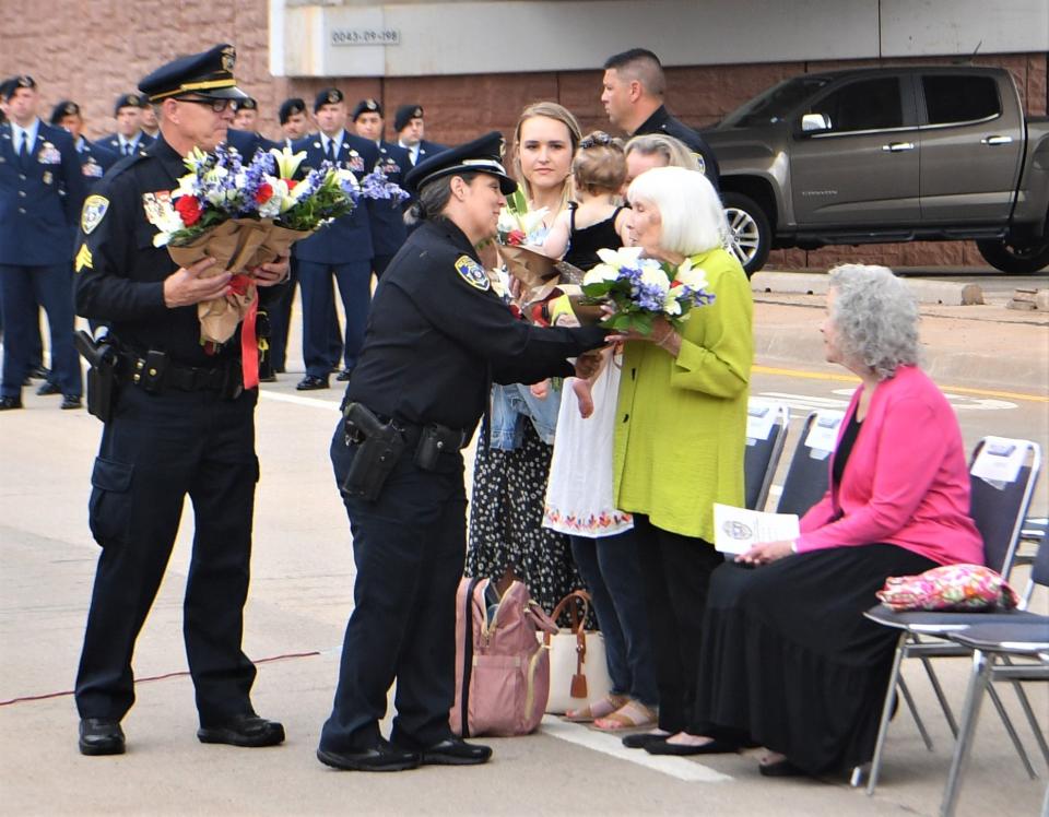 Families of fallen police officers are given flower bouquets during the Wichita Falls Police Department Memorial Ceremony on Monday, May 15, 2023.