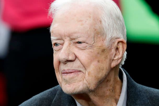 PHOTO: FILE - Former President Jimmy Carter sits on the Atlanta Falcons bench before the first half of an NFL football game between the Atlanta Falcons and the San Diego Chargers, Oct. 23, 2016, in Atlanta. (John Bazemore/AP, FILE)
