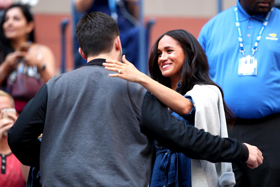 NEW YORK, NEW YORK - SEPTEMBER 07: (L-R) Alexis Ohanian, entrepreneur and husband of Serena Williams, embraces Meghan, Duchess of Sussex, before the Women's Singles final match between Serena Williams of the United States and Bianca Andreescu of Canada on day thirteen of the 2019 US Open at the USTA Billie Jean King National Tennis Center on September 07, 2019 in the Queens borough of New York City. (Photo by Clive Brunskill/Getty Images)