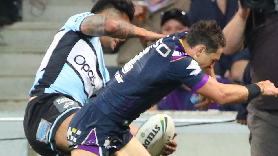 Billy Slater shoulder charges Sosaia Feki to stop him from scoring. (Photo by Scott Barbour/Getty Images)