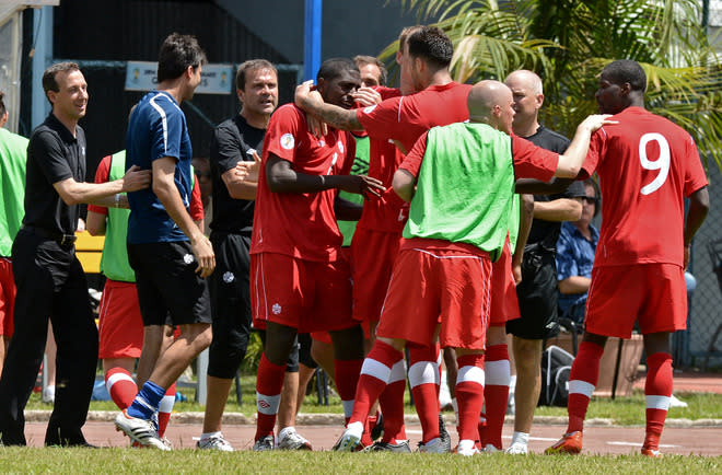 Canadian footballers celebrate the goal of Olivier Occean against Cuba during their FIFA World Cup Brazil 2014 CONCACAF qualifier match at the Pedro Marrero stadium in Havana on June 8, 2012. Canada won 1-0. AFP PHOTO/ADALBERTO ROQUEADALBERTO ROQUE/AFP/GettyImages