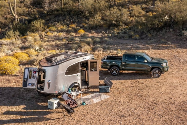 Metal trailer with truck in desert