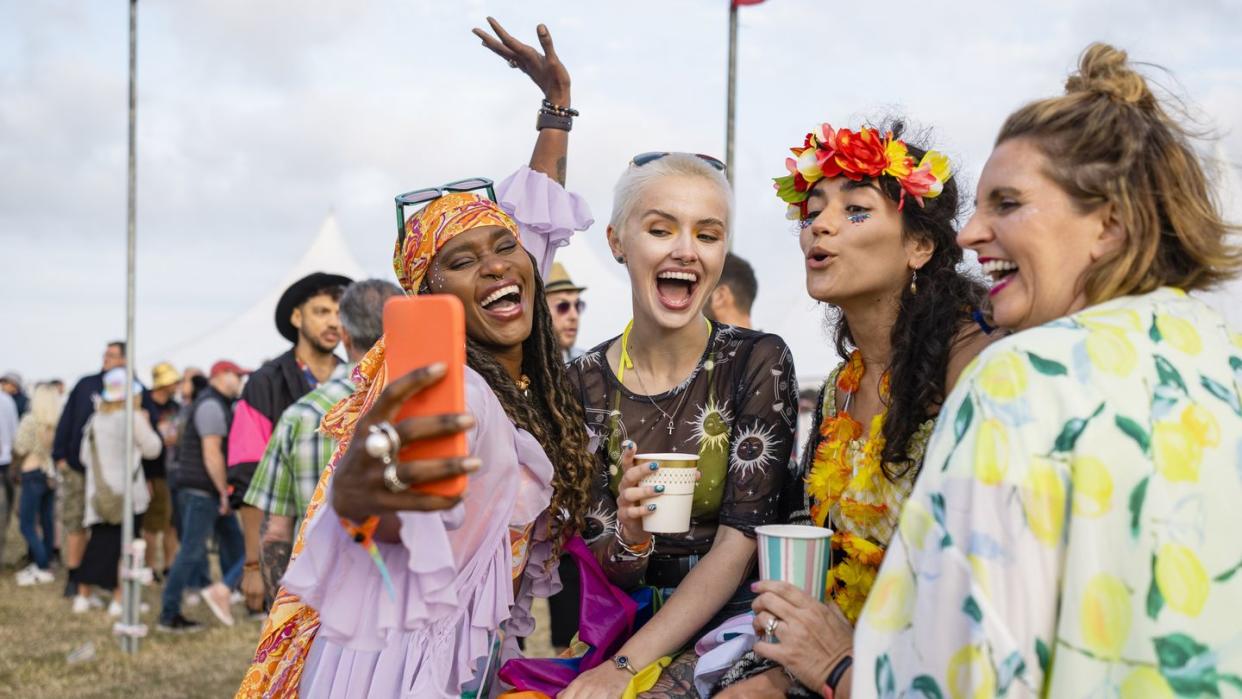 friends posing for selfies