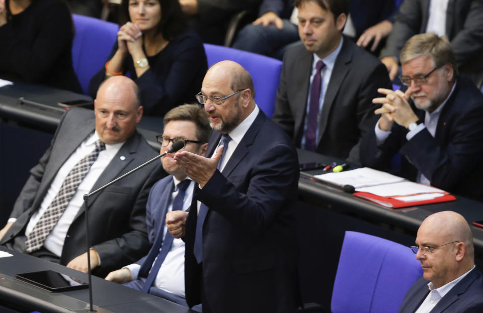 Former European Parliament President and former Social Democratic Party chairman Martin Schulz, center, speaks during a plenary session of the German parliament Bundestag about the budget 2019, in Berlin, Wednesday, Sept. 12, 2018. (AP Photo/Markus Schreiber)