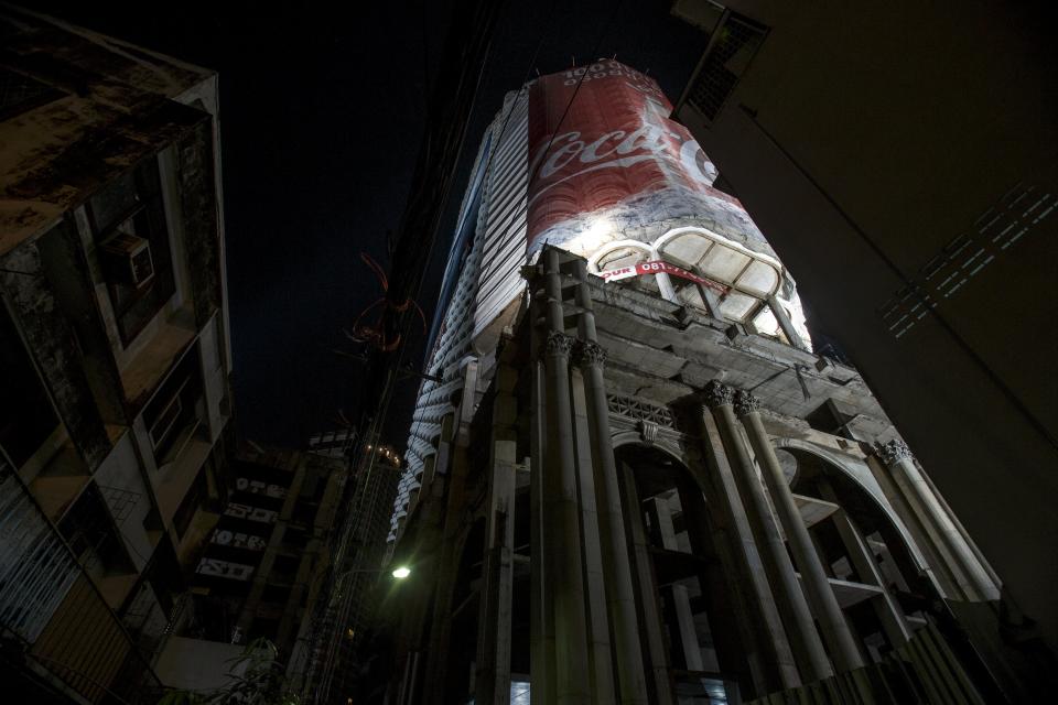 A view of an abandoned building is seen at Bangkok. The abandoned building, known as Sathorn Unique, dubbed the 'ghost tower' was destined to become one of Bangkok's most luxurious residential addresses but construction was never completed as the Thai economy was hit during the 1997 Asian Financial Crisis. Now, many travellers visit and explore the 49-story skyscraper. (REUTERS/Athit Perawongmetha)