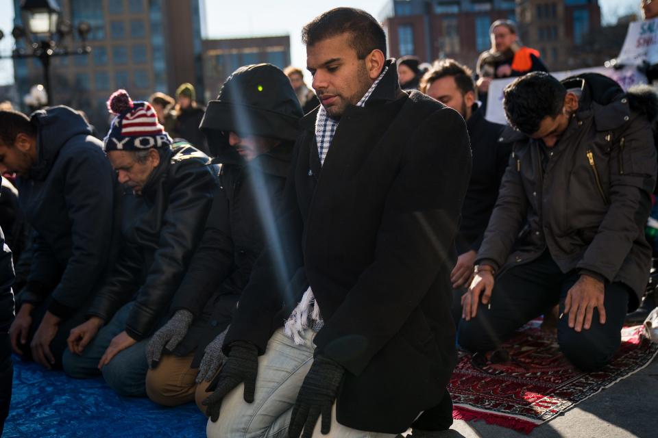 Muslim people pray following a protest in Washington Square Park, Jan. 26, 2018, in New York City to the mark the one-year anniversary of the Trump administration's executive order banning travel into the United States from several Muslim majority countries.