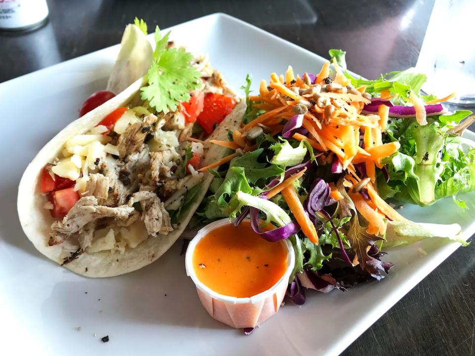 Taste Detours' Core Food Tour in Guelph highlights restaurants with a focus on fresh and local ingredients, like Atmosphere Café + etc. On the tour you can dine on jerk chicken tacos from the upscale café located on Carden St.