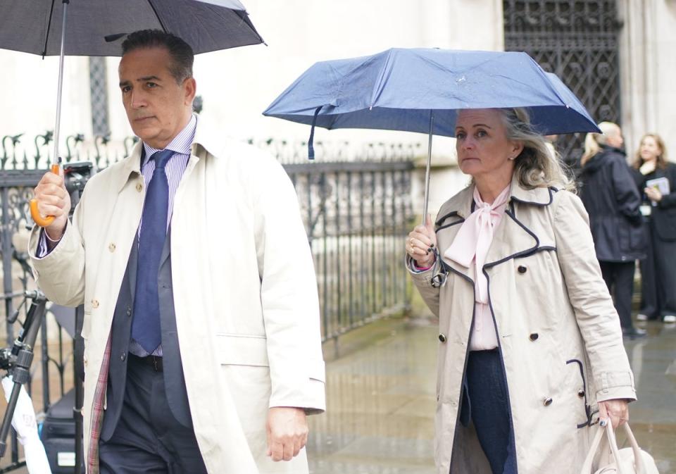 Parents of Grace, Dr Sanjoy Kumar and Dr Sinead O’Malley, arrive at the Royal Courts of Justice in central London on Tuesday (PA)