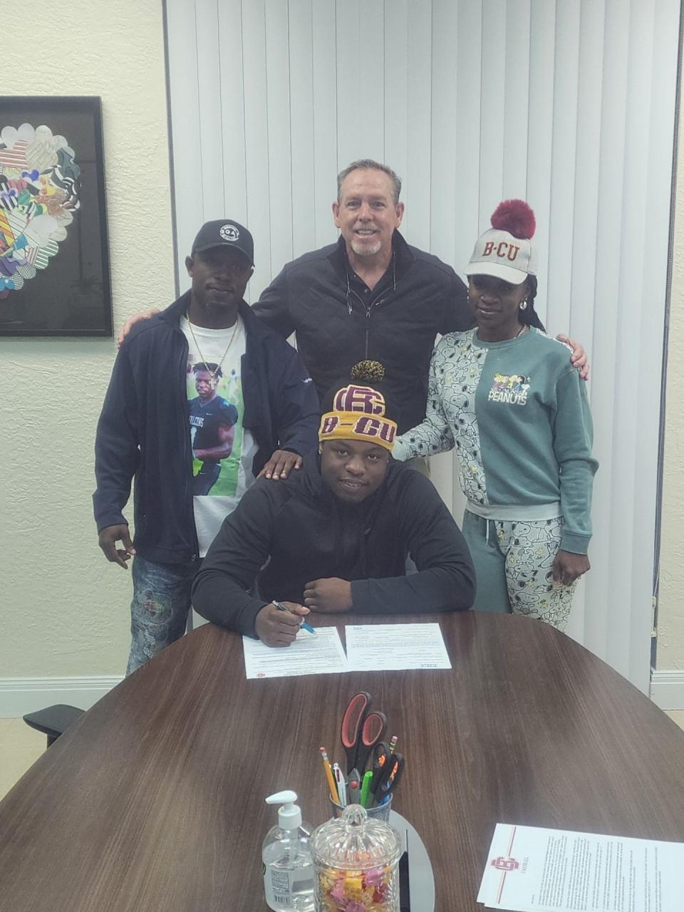 Jensen Beach running back Dennis Palmer Jr. signs his college letter of intent to play football at the Bethune-Cookman University on Wednesday, Feb. 7, 2023 from Jensen Beach High School.