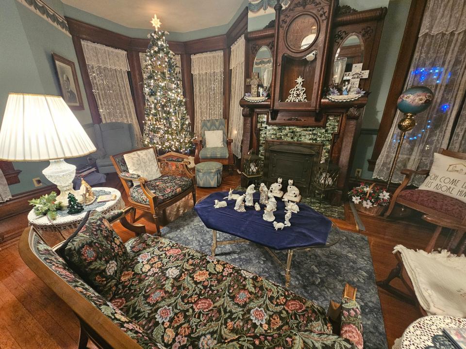 David and Kathy Waltz's home in Canton has six fireplaces. One, shown here, has a built-in clock on the mantel. The mantel is one of a multitude of features of the house, known as the Barber-Whitticar House on the National Historic Register. The home will be open to the public Thursday, Dec. 7, 2023, for a fundraiser for Canton Preservation Society.