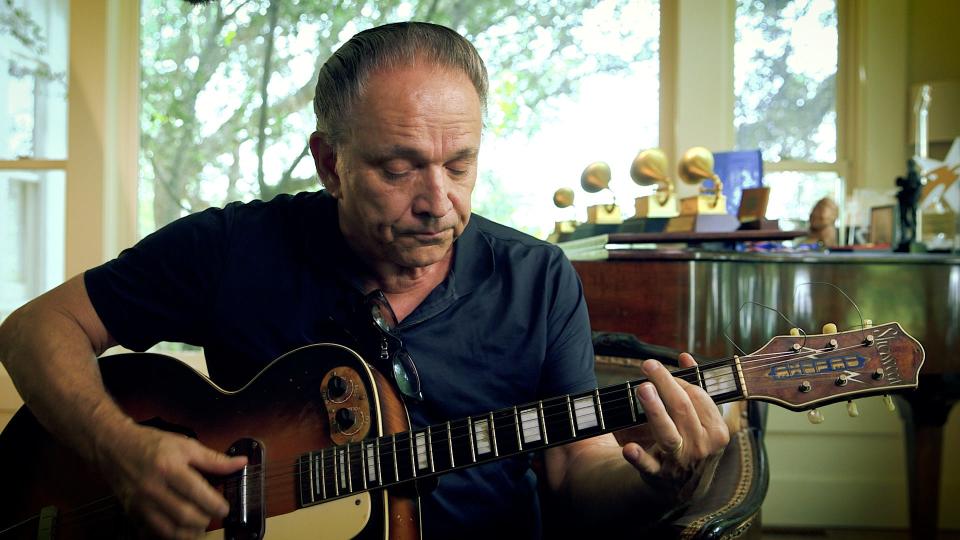 Jimmie Vaughan plays guitar in a scene from the music documentary, "Brothers in Blues."