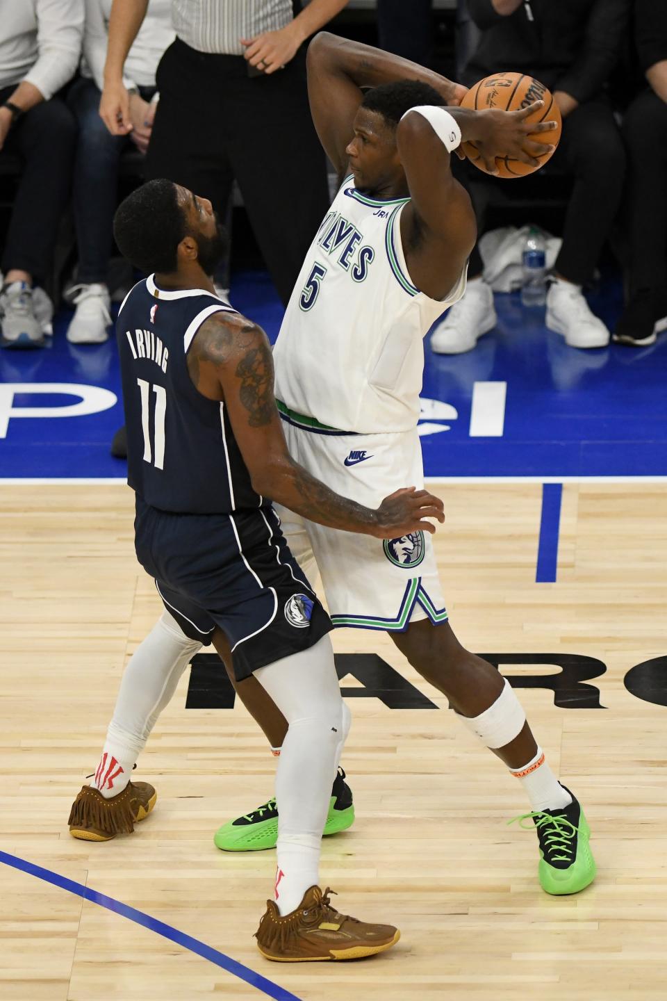 MINNEAPOLIS, MINNESOTA - MAY 22: Kyrie Irving #11 of the Dallas Mavericks defends against Anthony Edwards #5 of the Minnesota Timberwolves during the third quarter in Game One of the Western Conference Finals at Target Center on May 22, 2024 in Minneapolis, Minnesota. NOTE TO USER: User expressly acknowledges and agrees that, by downloading and or using this photograph, User is consenting to the terms and conditions of the Getty Images License Agreement. (Photo by Stephen Maturen/Getty Images)