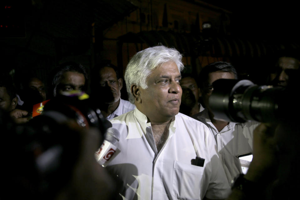Former Sri Lankan petroleum minister Arjuna Ranatunga leaves a magistrate court after receiving bail in Colombo, Sri Lanka, Monday, Oct. 29, 2018. On Monday, police arrested Ranatunga, a cricketer-turned politician, in connection with a shooting Sunday at the Petroleum Ministry, the first violence related to the islands’ political turmoil.(AP Photo/Eranga Jayawardena)