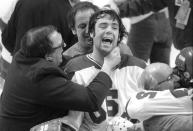 *ATTENTION AP SPORTS PHOTO DESK, EMBARGOED UNTIL 12:01AM ON FRIDAY, DECEMBER 21, 2020* In this Feb. 22, 1980, photo, Team USA goaltender Jim Craig got a hug from goalie coach Warren Strelow in the moments after defeating the Soviet Union during the medal-round of the Winter Olympics in Lake Placid, N.Y. Tourism is a $1.2 billion industry in the Lake Placid region, much of it still fueled by the memory of the U.S. hockey team beating the Soviet Union as the “Miracle on Ice" highlight of the 1980 Olympic Games. (Tom Sweeney/Star Tribune via AP)