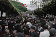 Algerians demonstrate in Algiers to mark the second anniversary of the Hirak movement, Monday Feb. 22, 2021. Thousands of protesters marking the second anniversary of Algeria's pro-democracy movement took to the streets Monday in the Algerian capital where a wall of security forces stepped aside to let marchers pass. (AP Photo/Toufik Doudou)