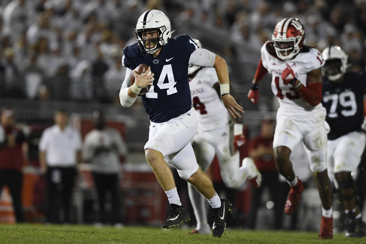 Penn State quarterback Sean Clifford (14) scrambles against Indiana in the second half of their NCAA college football game in State College, Pa., on Saturday, Oct. 02, 2021. Penn State defeated Indiana 24-0. (AP Photo/Barry Reeger)