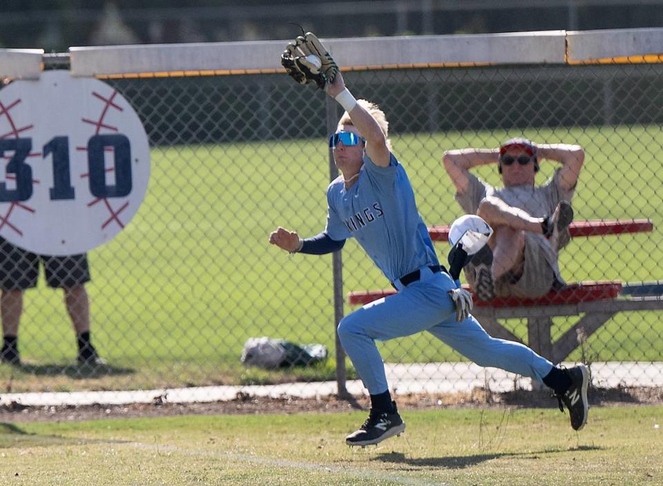 Oakmont left fielder KC Tibbits runs down a fly ball during the Northern California Regional Division III championship game with Central Catholic at Central Catholic High School in Modesto, Calif., Saturday, June 3, 2023.