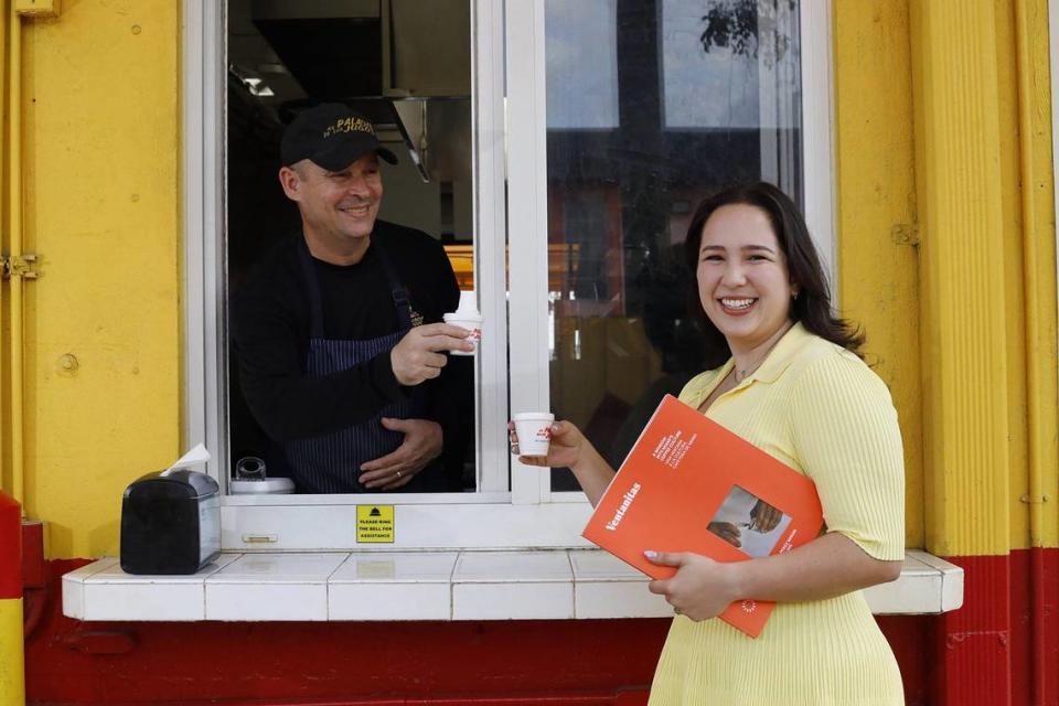 José Alejandro Fernandez serves cafecito’to Daniela Pérez Miron, author of the book ‘Ventanitas: A Window into Miami’s Coffee Culture,’ at El Palacio De Los Jugos, on Coral Way, Miami. Lex Fodere/Special for the Herald