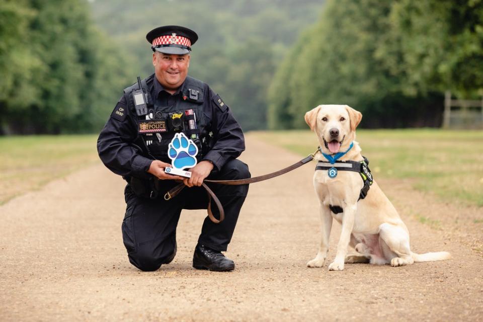 Pc Colin Nash and two-year-old labrador Elvis (Penny Bird/Thin Blue Paw Awards/PA) (PA Media)